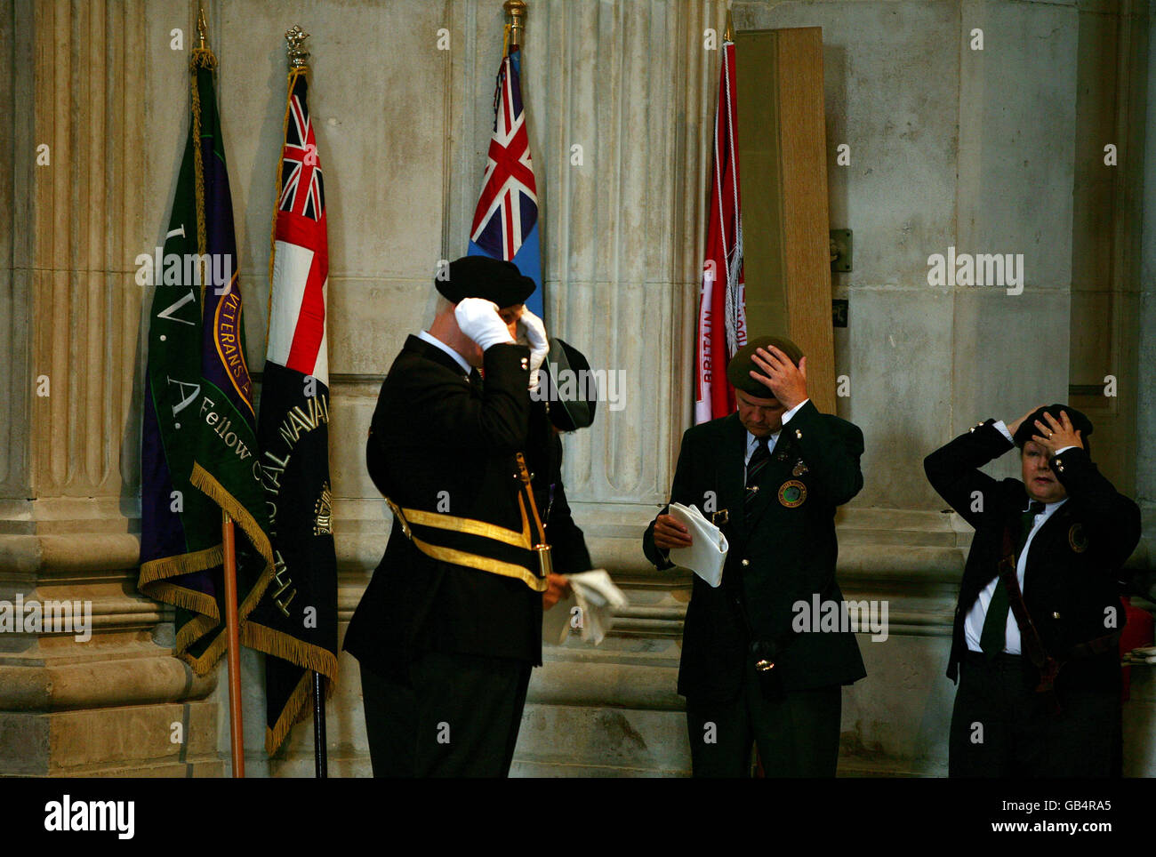Flag bearers adjust their berets as guests arrive at St.Paul's