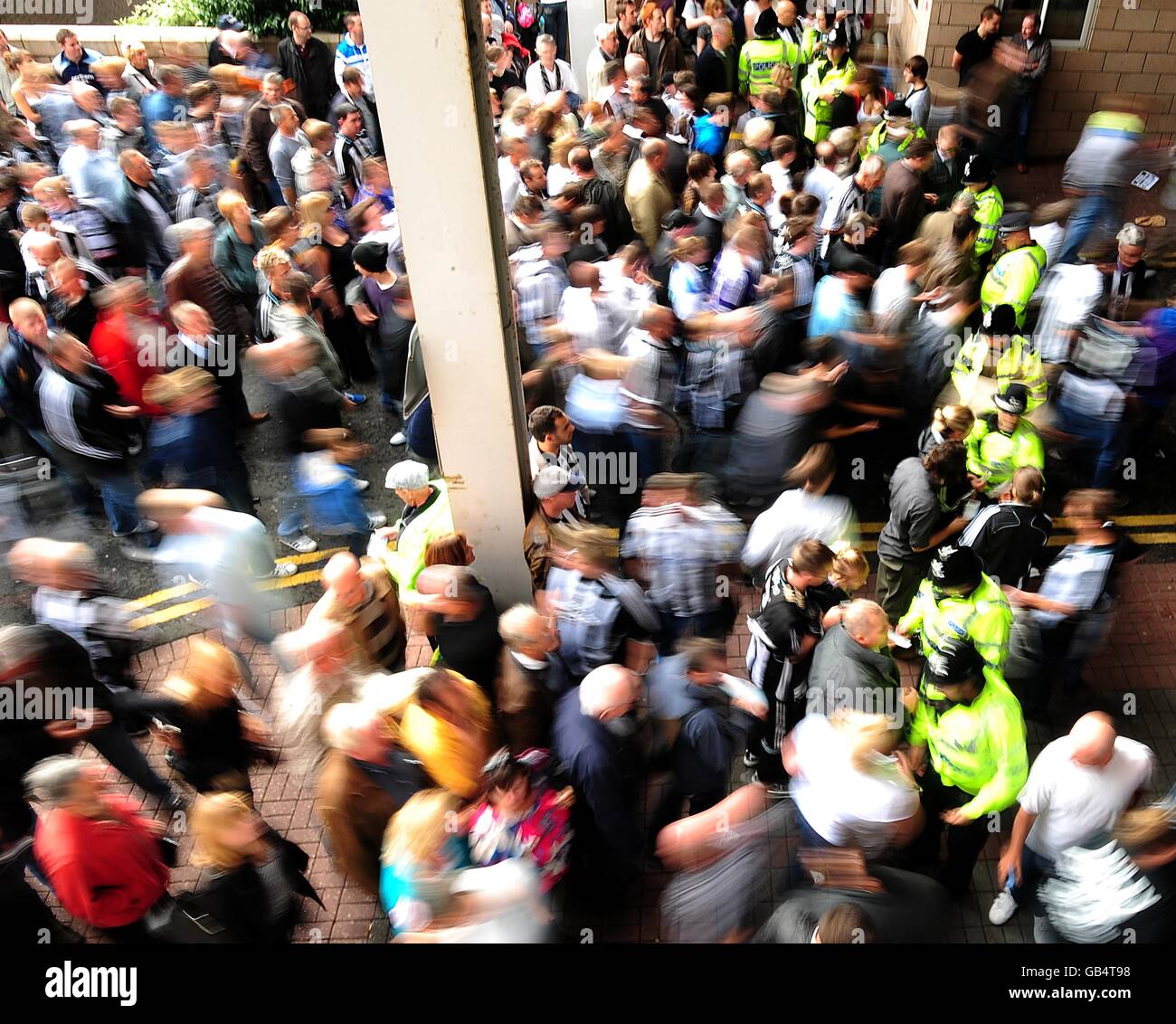 Newcastle United supporters make their way through a Police line as they protest against club owner Mike Ashley and Director of Football Dennis Wise before the match Stock Photo