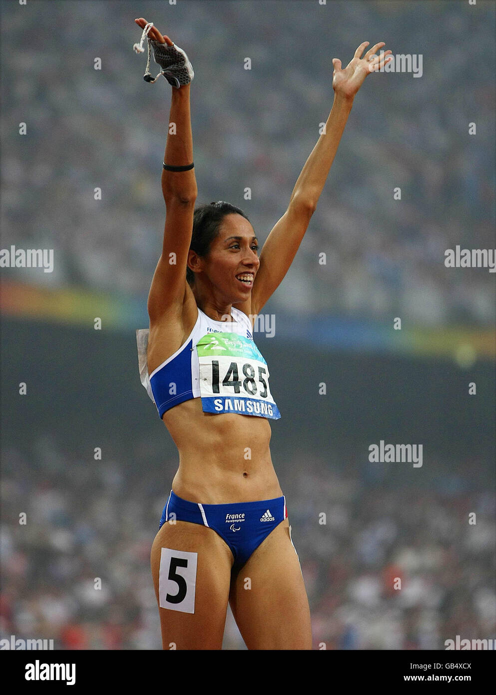 France's Assia El'Hannouni celebrates after winning the Womens 200M T12 Final in the National Stadium, in Beijing, China. Stock Photo