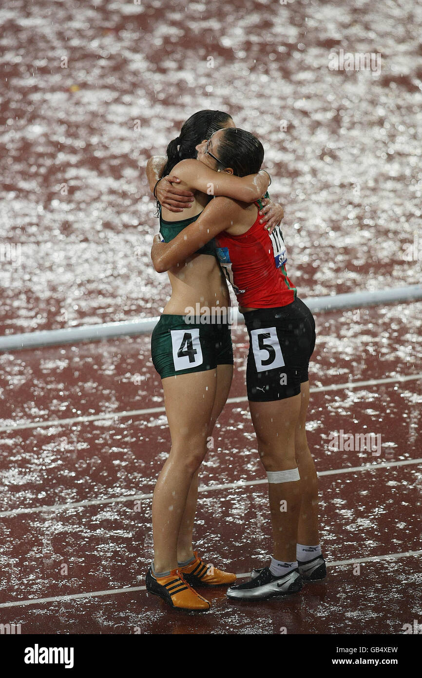 Morocco's Sanaa Benhama celebrates after winning the Women's 100M T13 with Silver medal winner Lise Hayes of South Africa (left) in the National Stadium, in Beijing, China. Stock Photo