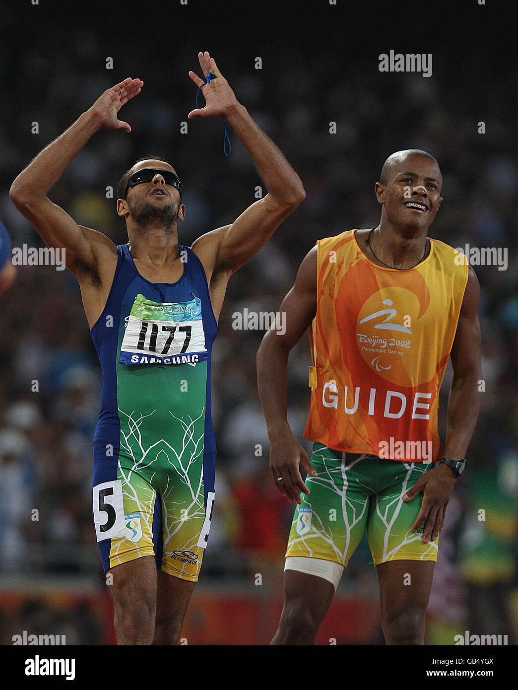 Paralympics - Beijing Paralympic Games 2008 - Day Ten. Brazil's Lucas Prado celebrates winning gold with his guide in the men's 400M T11 Final in the National Stadium, in Beijing, China. Stock Photo