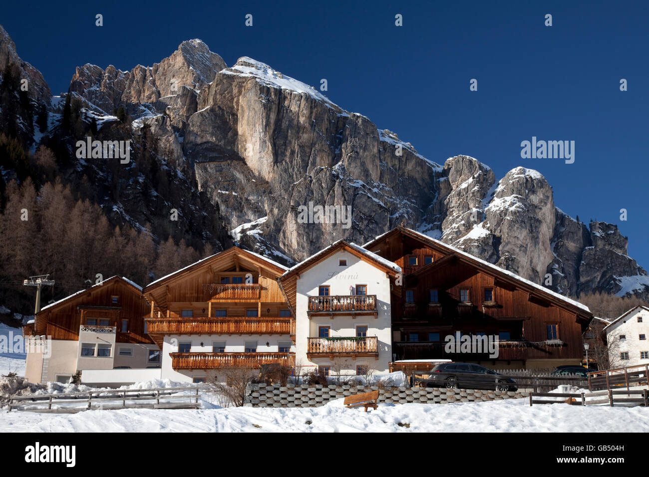 Houses in front of the Sella massif, Kolfuschg, Colfosco, Val Badia