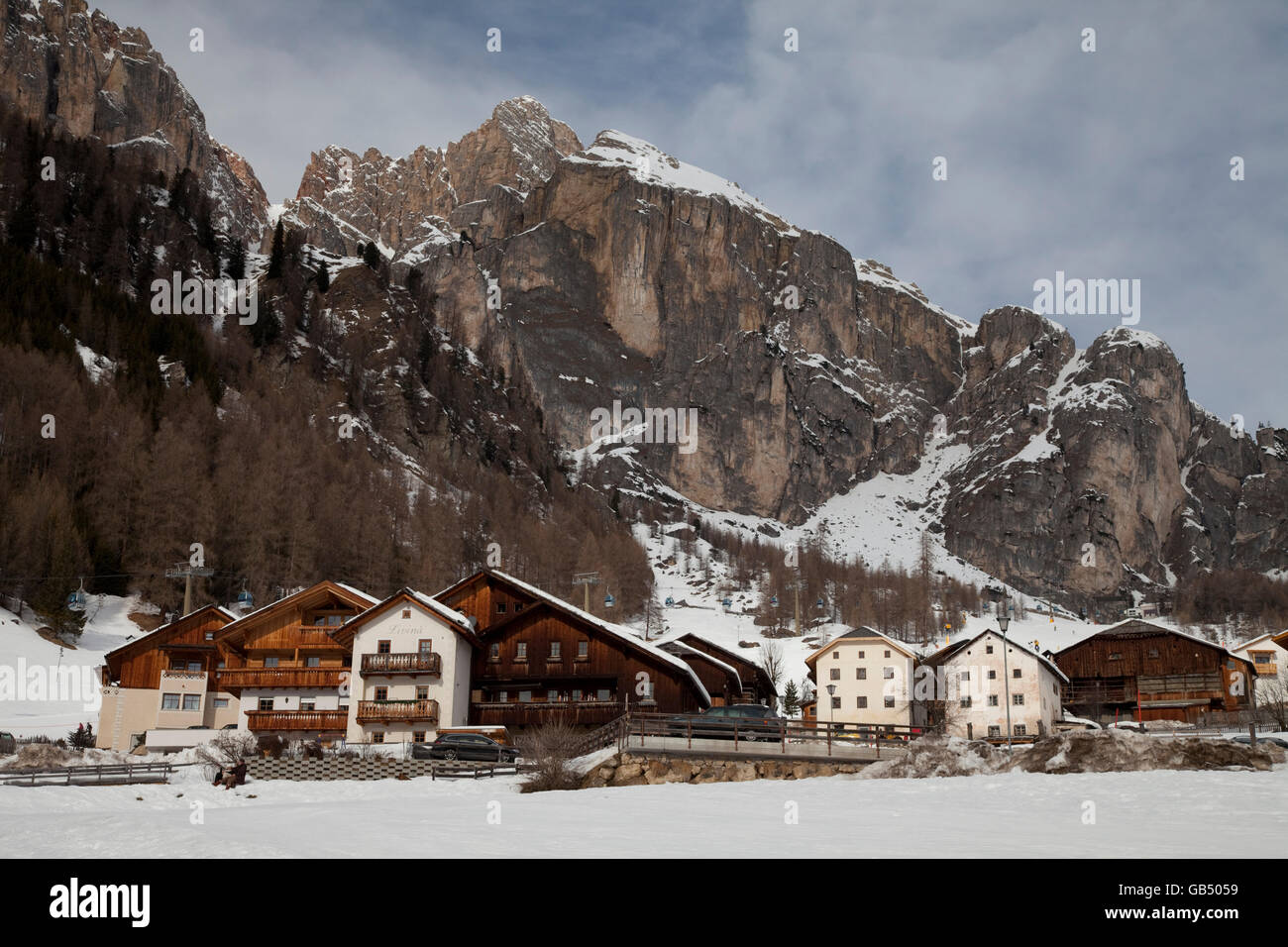 Houses in front of the Sella massif, Kolfuschg, Colfosco, Val Badia
