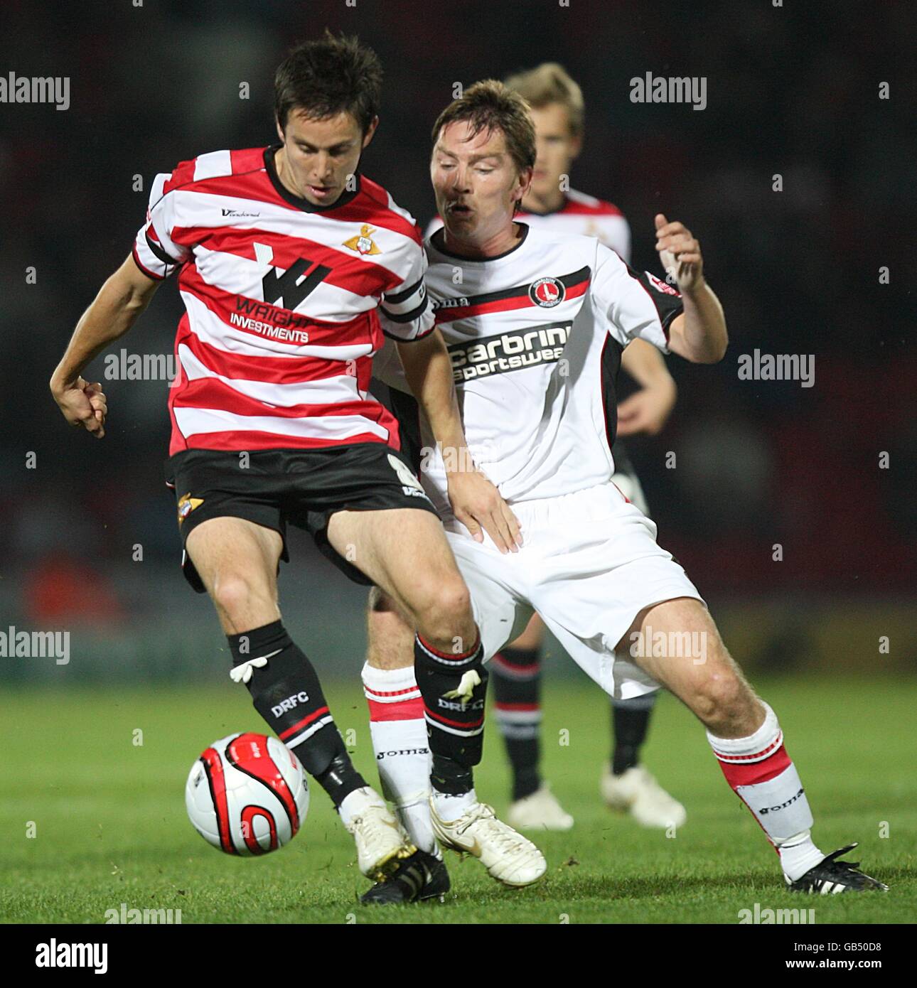 Soccer - Coca-Cola Football League Championship - Doncaster Rovers v Charlton Athletic - Keepmoat Stadium. Charlton Athletic's Matthew Holland (r) and Doncaster Rovers' Brian Stock battle for the ball Stock Photo