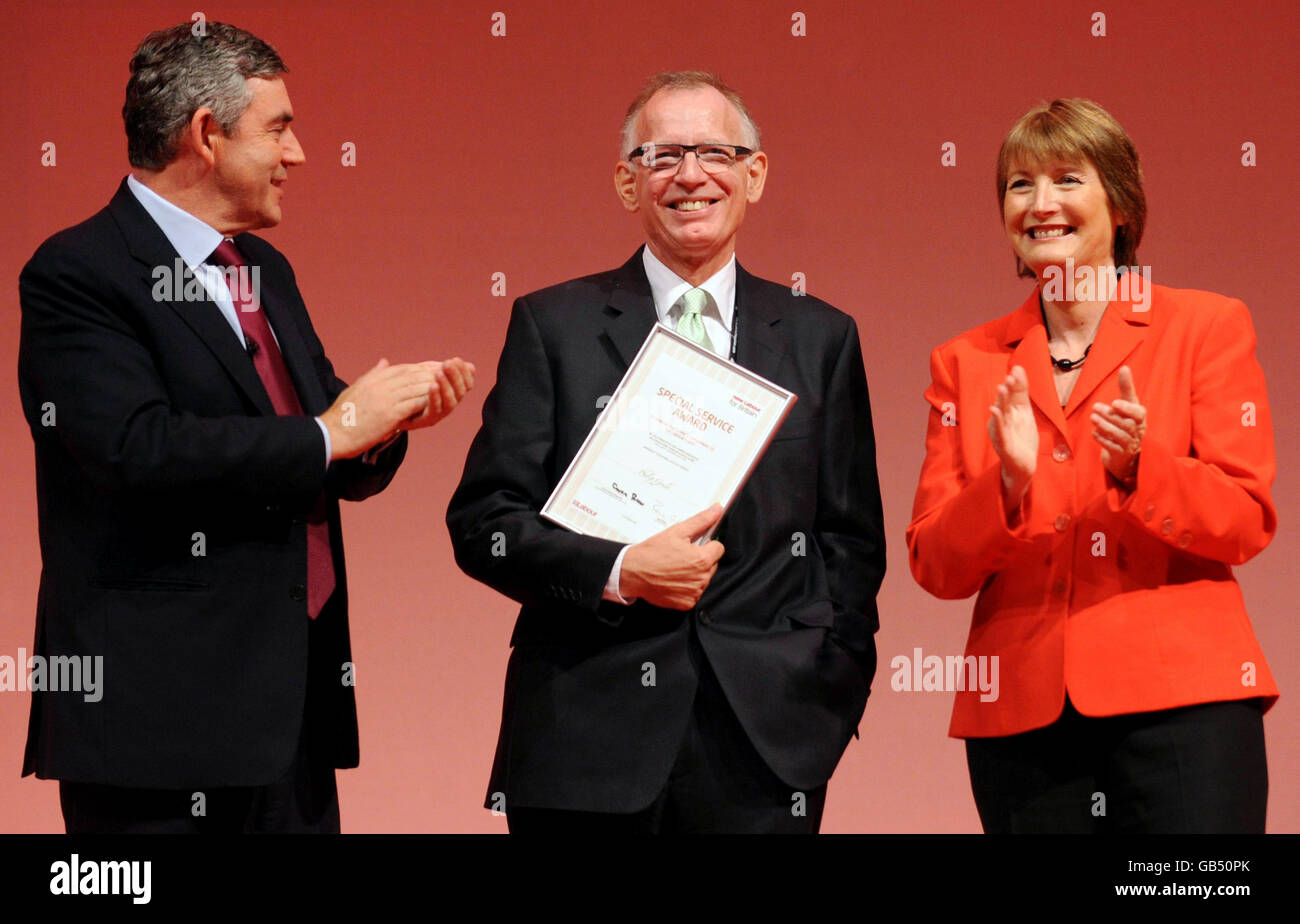 Prime Minister Gordon Brown and Labour party deputy leader Harriet Harman present Labour party advisor Philip Gould, who has recently been suffering from cancer, with a special service award. Stock Photo