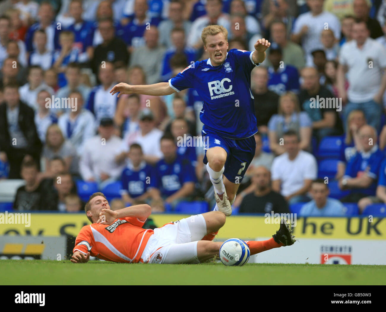 Soccer - Coca-Cola Football League Championship - Birmingham City v Blackpool - St Andrews Stadium. Birmingham City's Sebastian Larsson is brought down by Blackpool's Rob Edwards Stock Photo