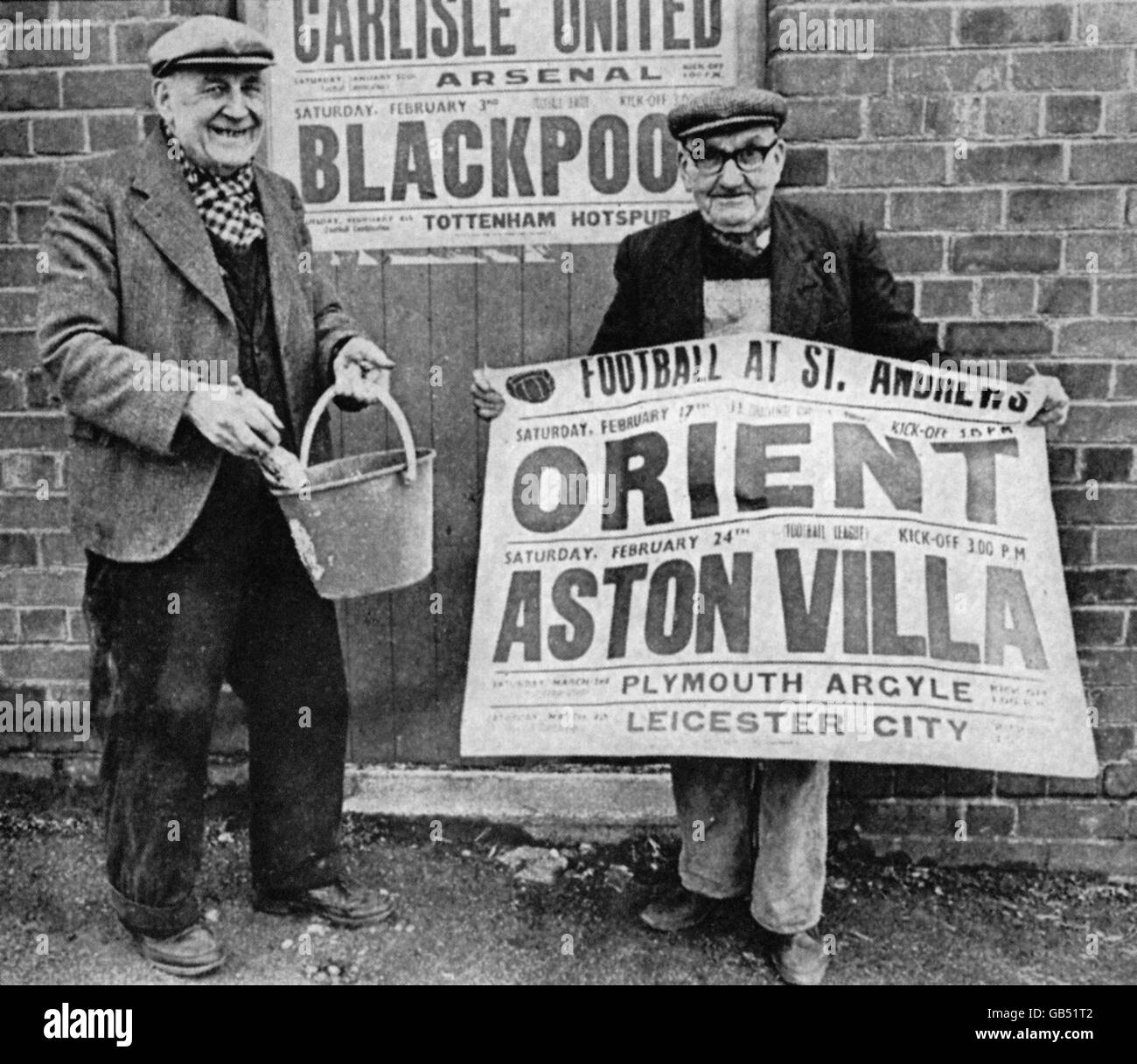 (L-R) Birmingham City's George Moore and Tommy Bell prepare to paste up a poster advertising the forthcoming fixtures taking place at St Andrew's. Stock Photo