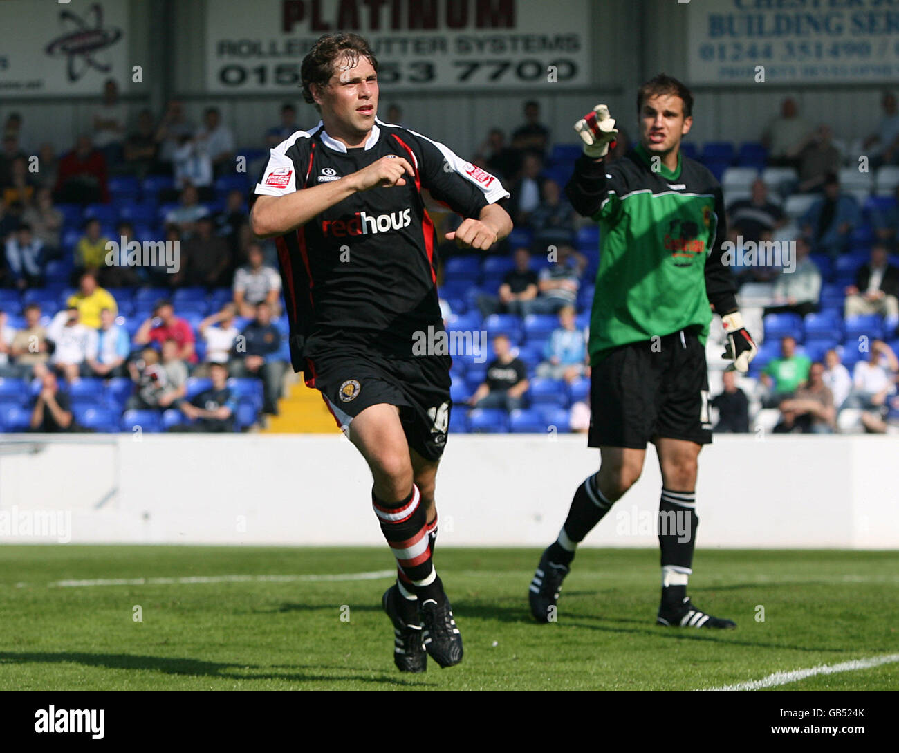 Soccer - Coca-Cola Football League Two - Chester City v Shrewsbury Town - Deva Stadium. Shrewsbury Town's Grant Holt celebrates scoring from the penalty spot against Chester City as keeper John Danby points an accusing finger Stock Photo