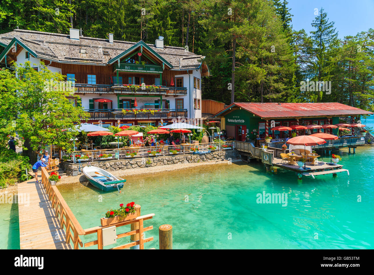 WEISSENSEE LAKE, AUSTRIA - JUL 7, 2015: restaurant and guest house on shore of Weissensee lake in summer time. Weissensee has dr Stock Photo