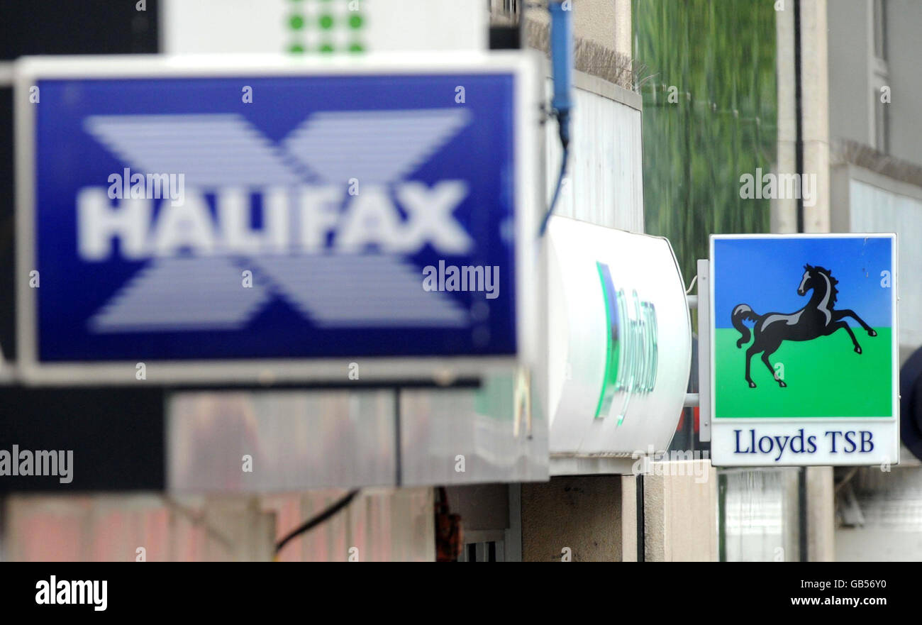 Possible merger between Lloyds TSB and HBOS. Halifax and Lloyds TSB bank signs on the Strand in London. Stock Photo