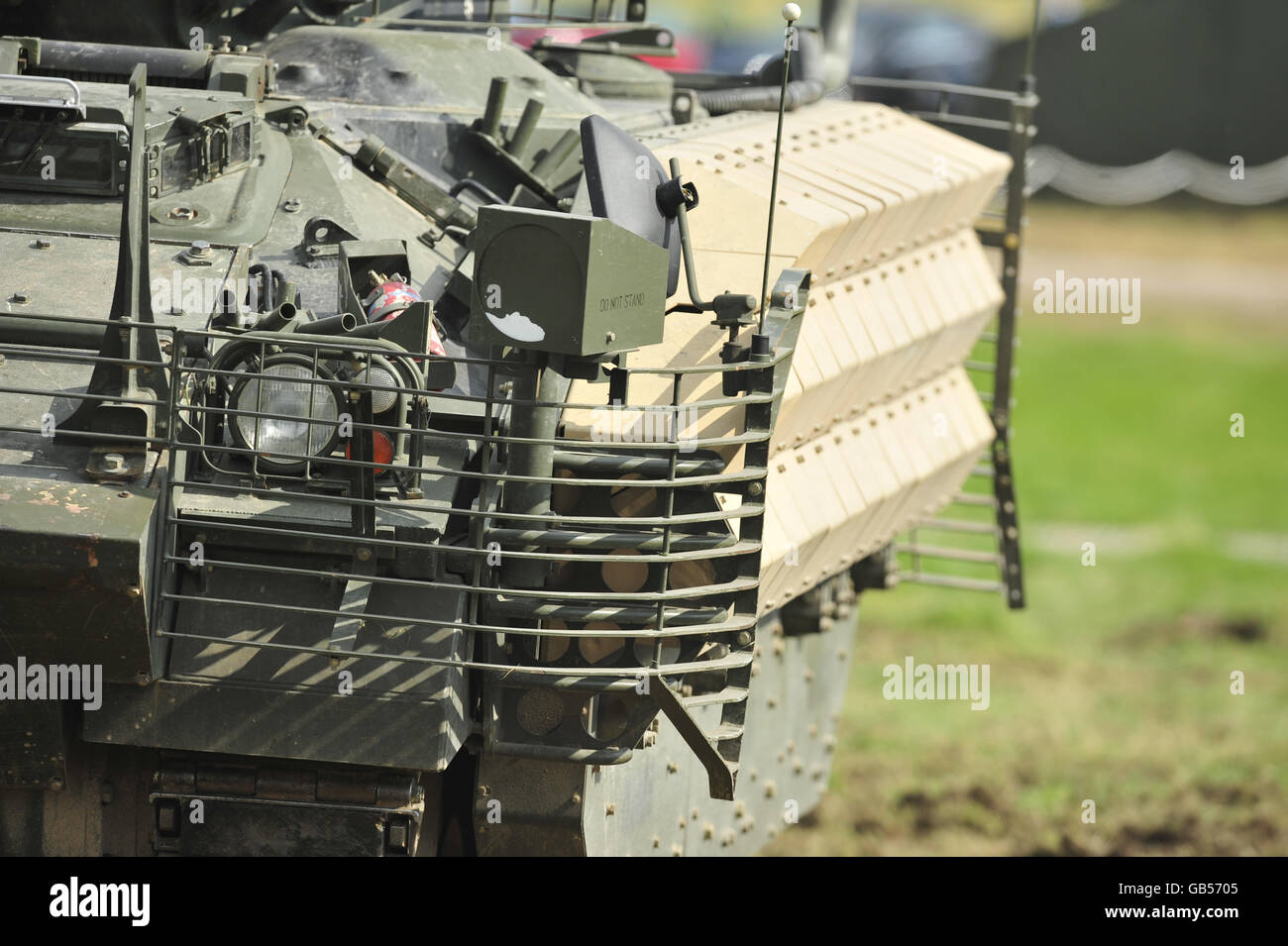 A Warrior tank with Enhanced Armour fitted in the form of heavy duty metal grids and sections that are covered in sheet steel causing anti-tank weapons to detonate further from the body of the vehicle and prevent full penetration through the vehicle's skin. The Army Urgent Operational Requirement (UOR) day, held at Salisbury Plain showcases new modifications to existing vehicles and equipment that is being sent out to warzones plus new mllitary equipment that is undergoing trials for possible issue to troops on operations. Stock Photo