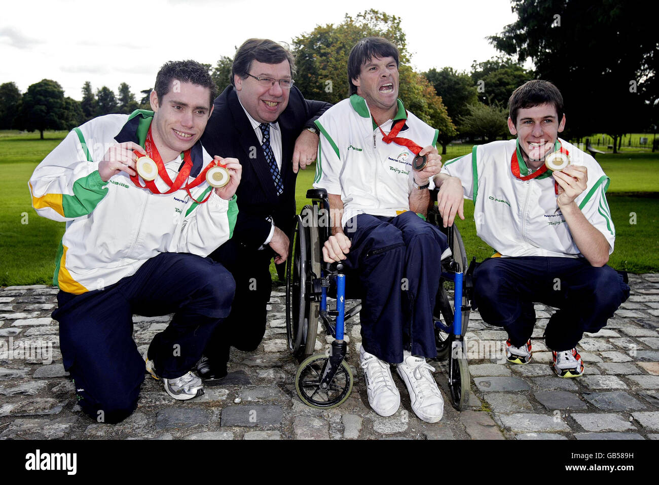 Taoiseach Brian Cowen greets Ireland's medal-winning paralympians (left to right) Jason Smyth, Gabriel Shelly and Michael McKillop during a reception at Farmleigh House in Phoenix Park. Stock Photo