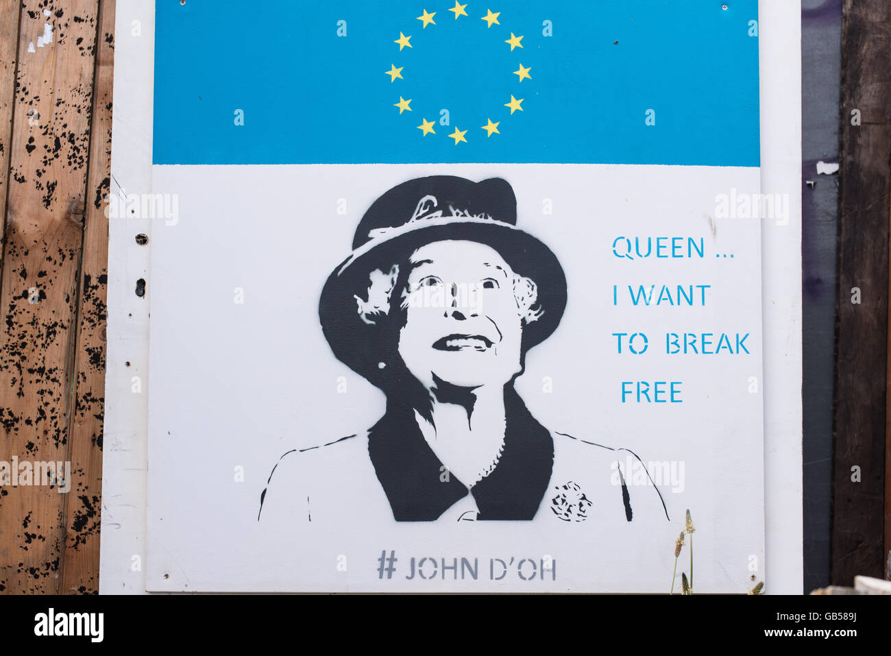 Graffiti representing Queen Elizabeth II smiling below an EU flag and with the words Queen Stock Photo