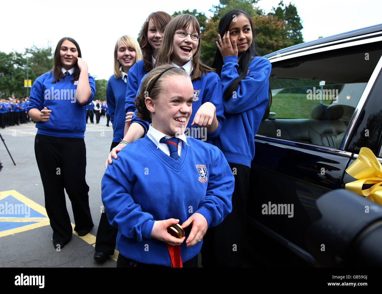 Paralympic swimmer Eleanor Simmonds, who is Britain's youngest ever individual Paralympic gold medallist, is welcomed back by classmates as she returns to Olchfa School in Swansea. Stock Photo