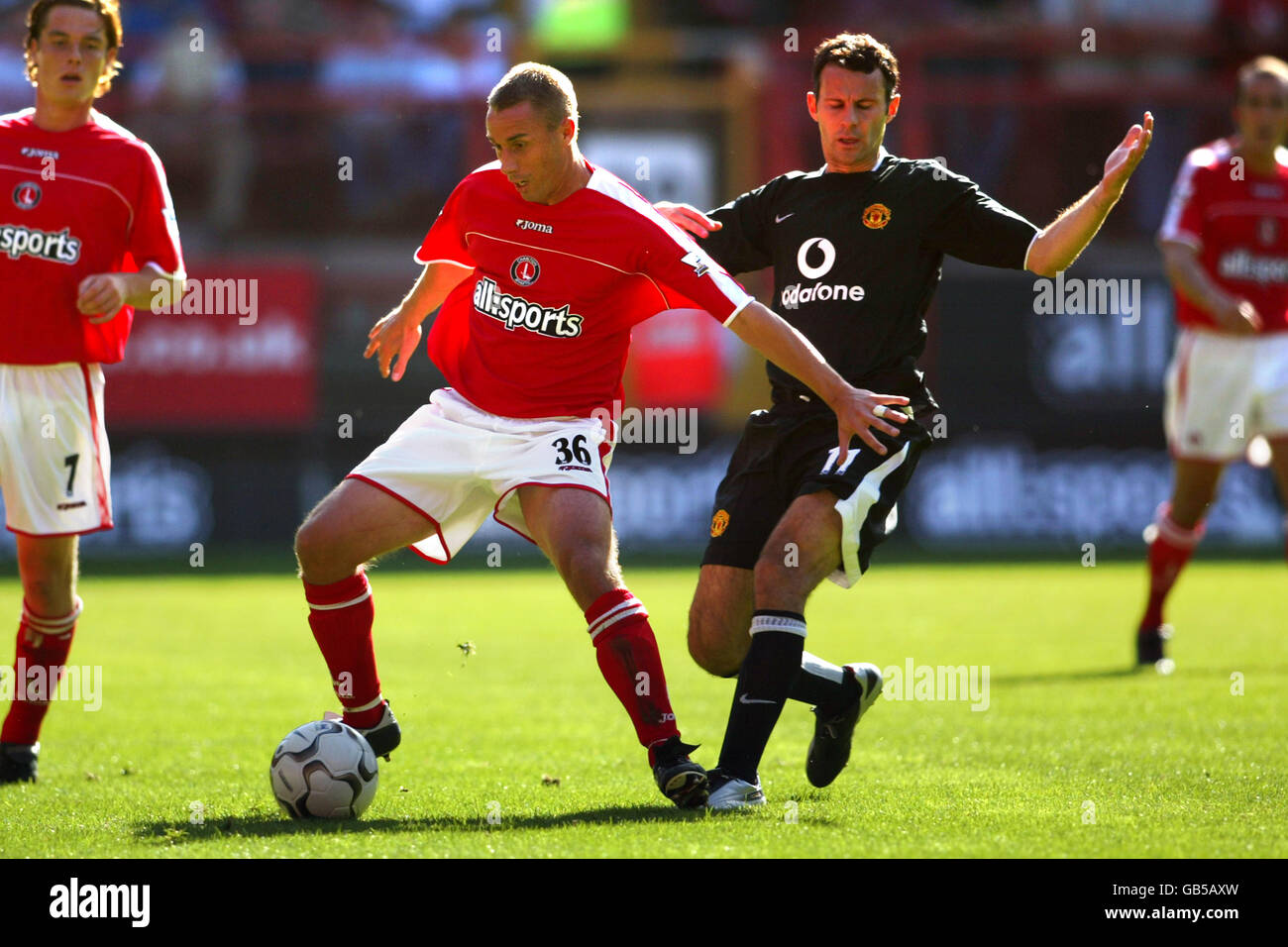 (L-R) Charlton Athletic's Chris Perry holds off Manchester United's ...