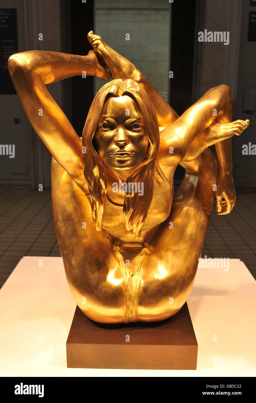 A 50kg solid gold statue of supermodel Kate Moss in a yogic pose called 'Siren' is unveiled at the opening of the 'Statuephilia' exhibition at the British Museum in London. Stock Photo