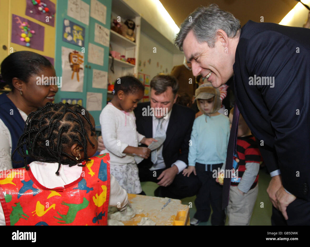 Prime Minister Gordon Brown (right) and Schools Secretary Ed Balls (centre) during a visit to a Surestart Nursery at Bermondsey Community Centre, south east London. Stock Photo