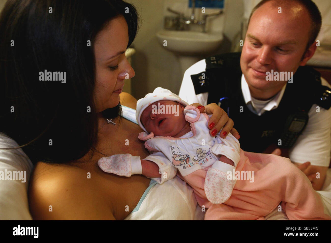 Female police officer holding child hires stock photography and images