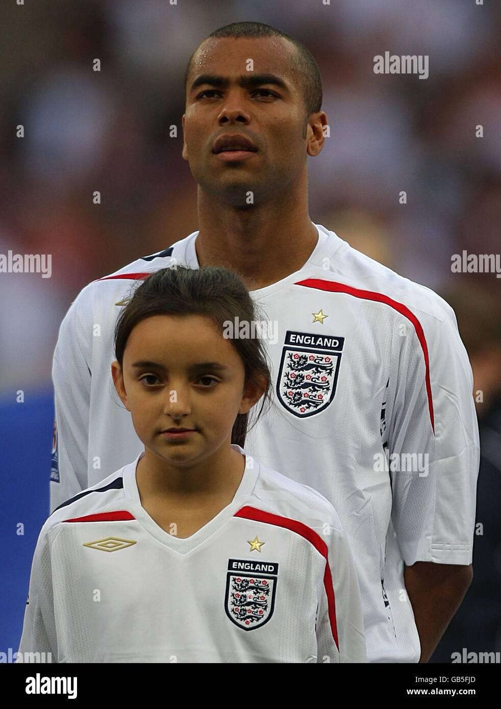 Soccer - FIFA World Cup 2010 - Qualifying Round - Group Six - England v Kazakhstan - Wembley Stadium. England's Ashley Cole with a young mascot. Stock Photo