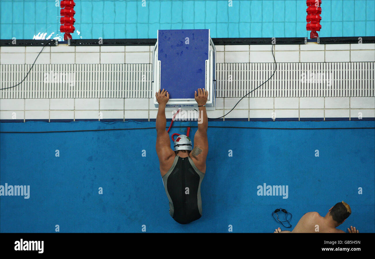 Paralympics - Beijing Paralympic Games 2008 - Day Nine. Mexico's Pedro Rangel stretches at the pool edge before the Men's 4X50M Medley Final in the National Acquatic Centre, Beijing. Stock Photo