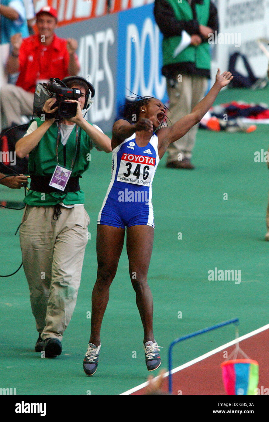 France's Eunice Barber celebrates as she finds out that her last jump wins the competition Stock Photo