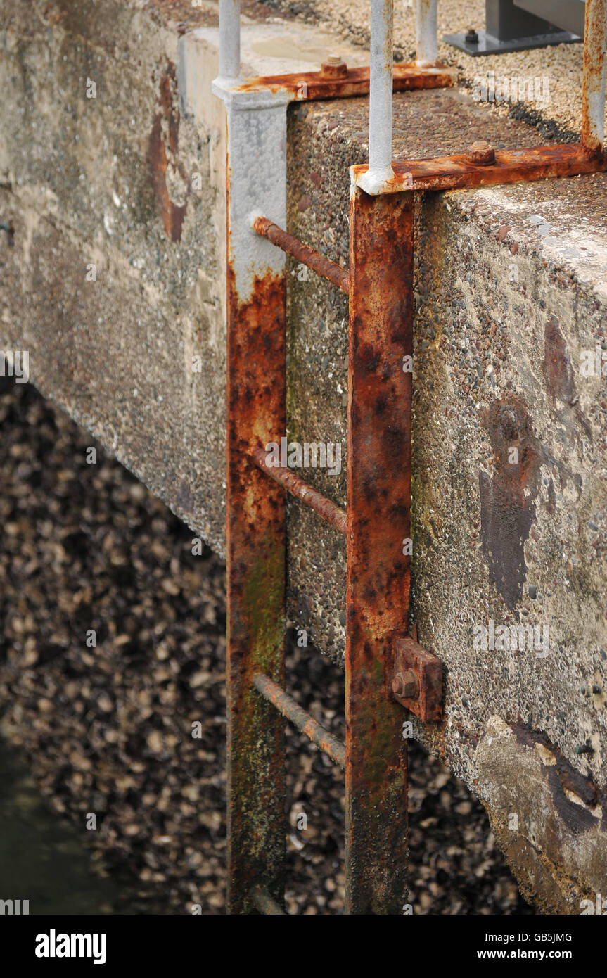 Rusty Ladder Fixed to Concrete Stock Photo - Alamy
