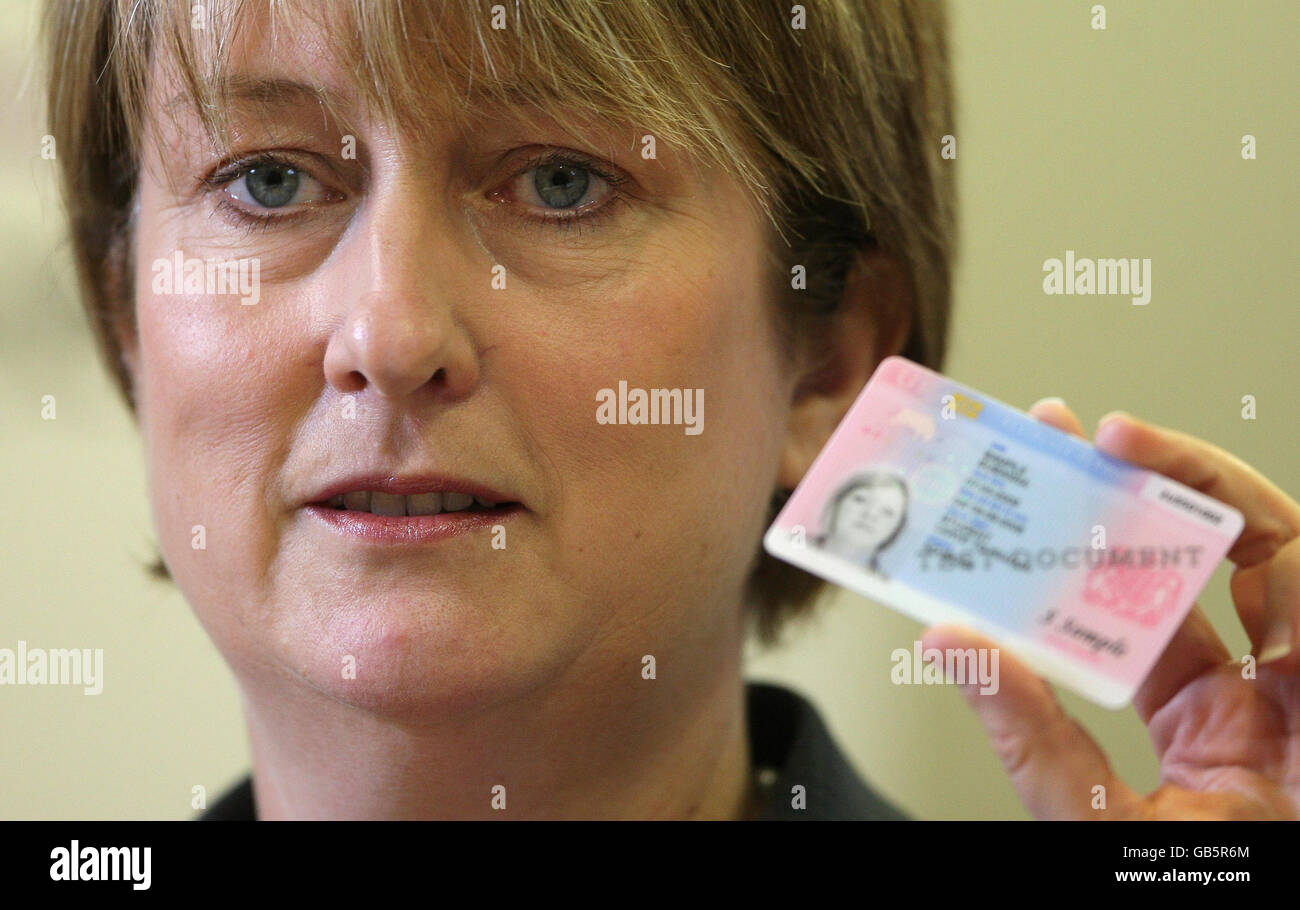 Home Secretary Jacqui Smith holds an example of a new identity card at
