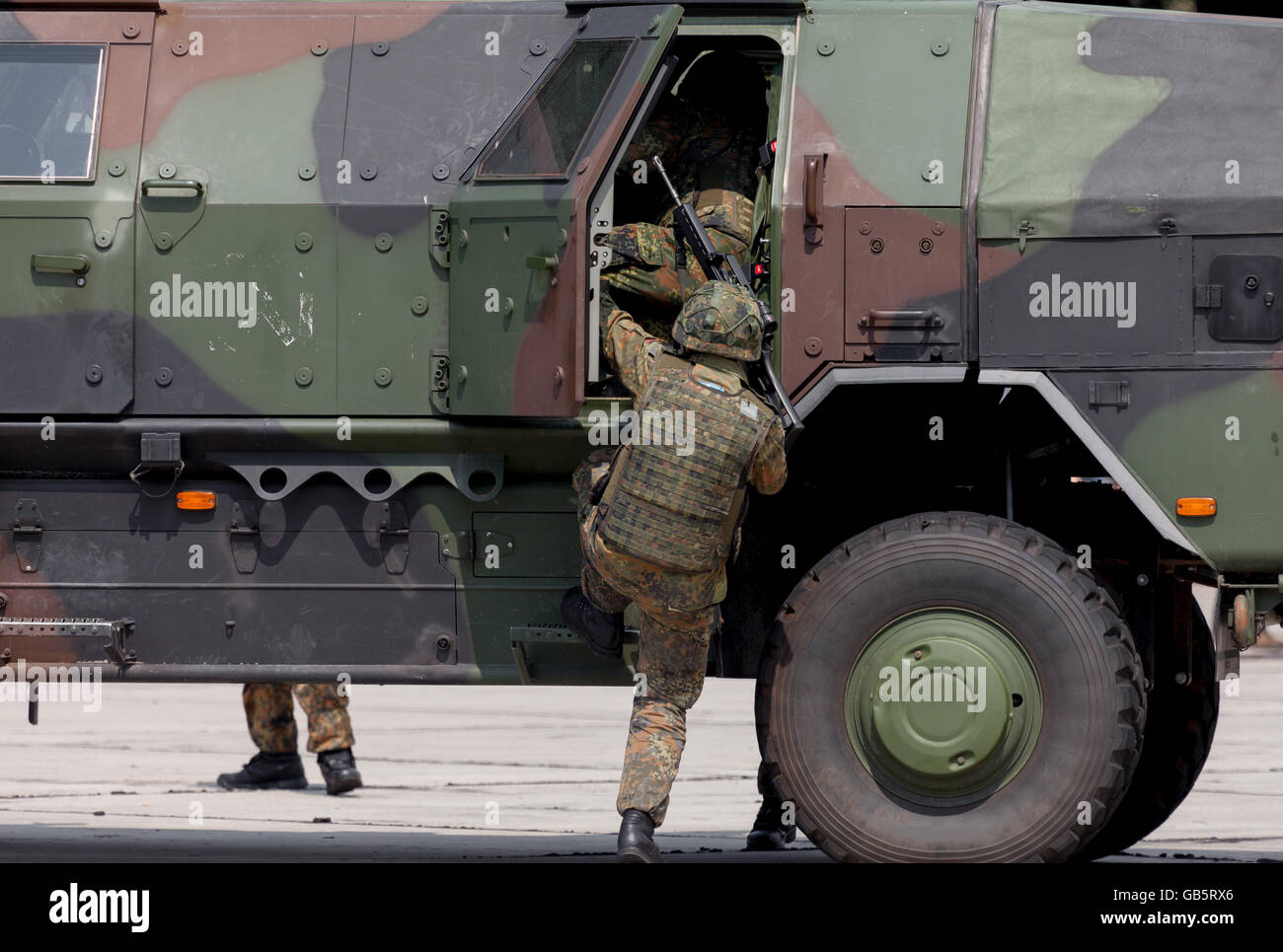 german soldier get into an armoured vehicle Stock Photo