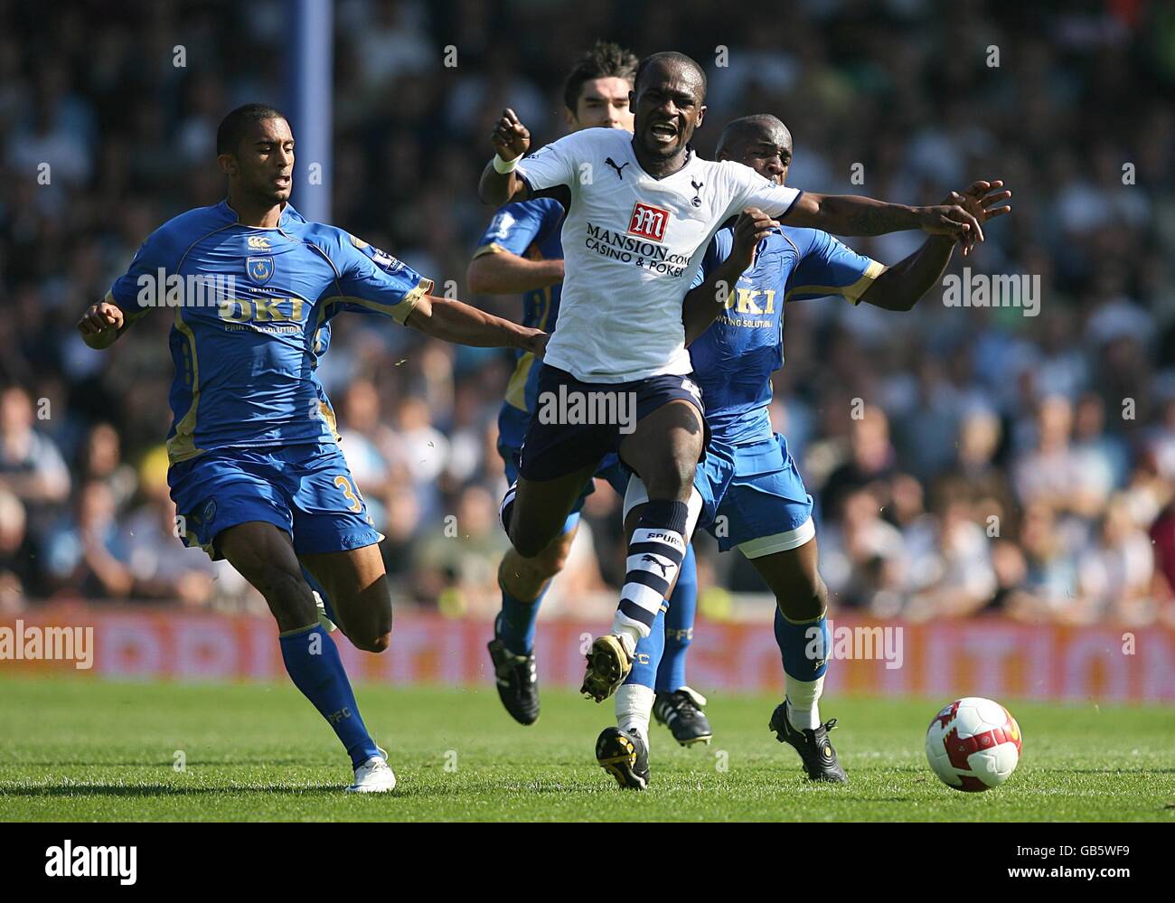 Soccer - Barclays Premier League - Portsmouth v Tottenham Hotspur - Fratton Park. Portsmouth's Lassana Diarra (r) fouls Tottenham Hotspur's Didier Zokora (c) as they battle for the ball Stock Photo