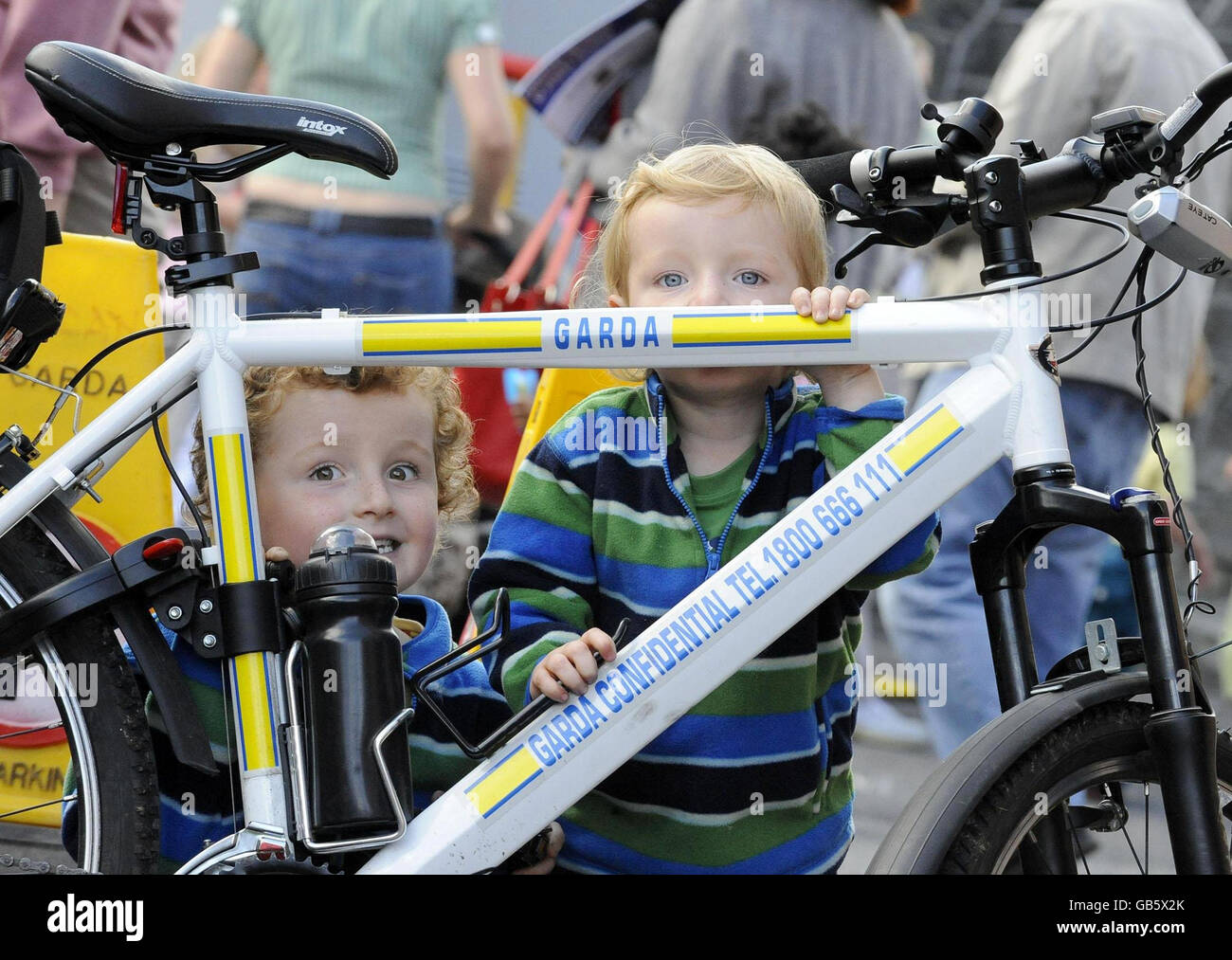 A child stands next to a police bike during the Intercultural Family Day at Lucan Garda Station in Co Dublin, an event aimed at strengthening relationships between gardai and the local community, particularly members of the immigrant community. Stock Photo