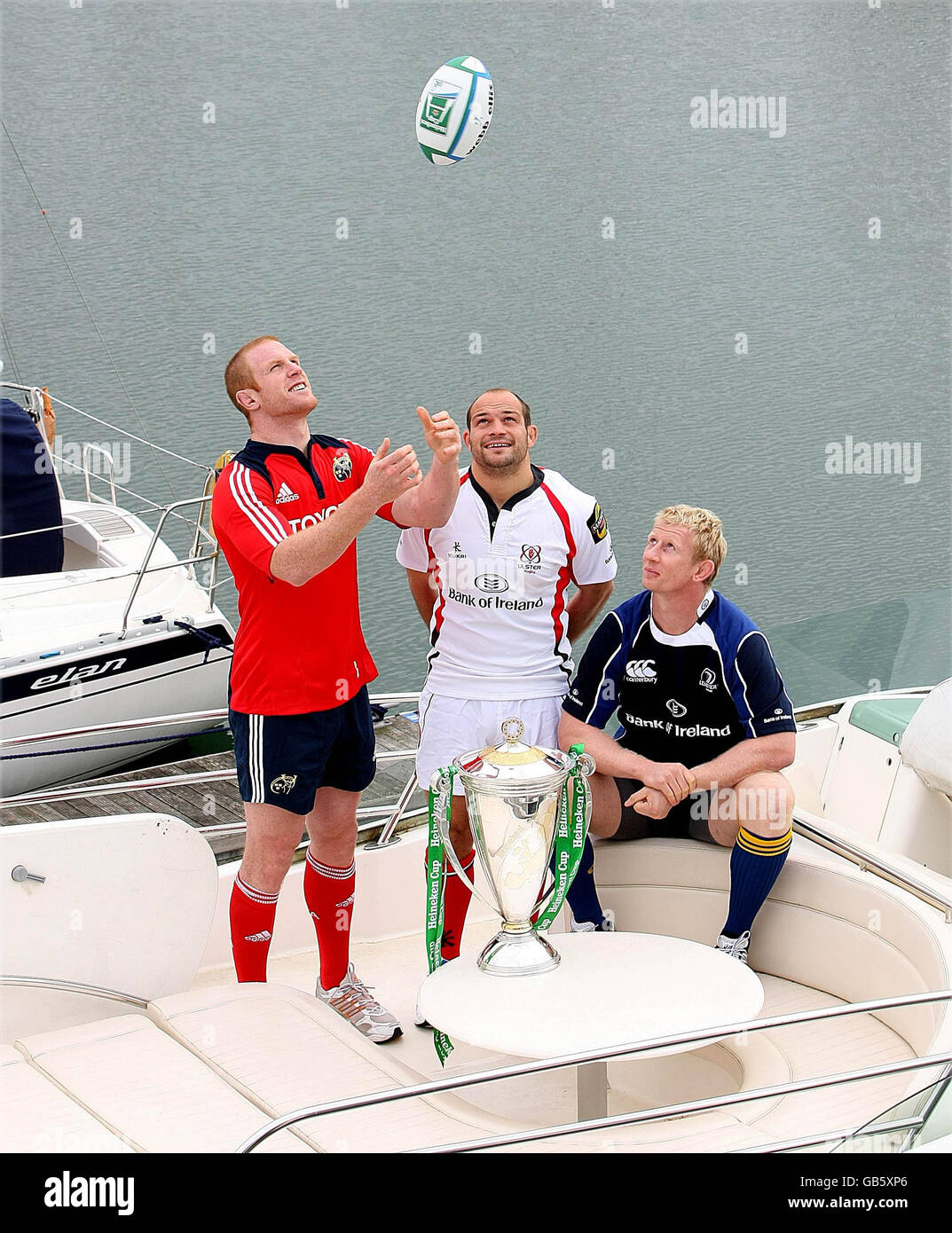 Munster's Paul O'Connell (left) with Ulster's Rory Best and Leinster's Leo Cullen (right) with the Heineken Cup during the Heineken Cup Launch at the marina near Cruzzo Restaurant in Malahide, Dublin, Ireland. Stock Photo