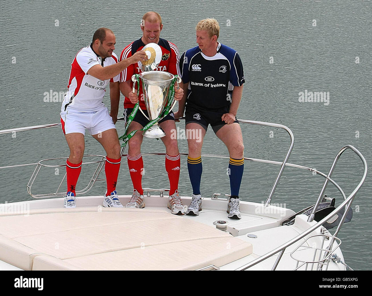 Leinster's Leo Cullen (right) with Munster's Paul O'Connell (centre) and Ulster's Rory Best with the Heineken Cup during the Heineken Cup Launch at the marina near Cruzzo Restaurant in Malahide, Dublin, Ireland. Stock Photo