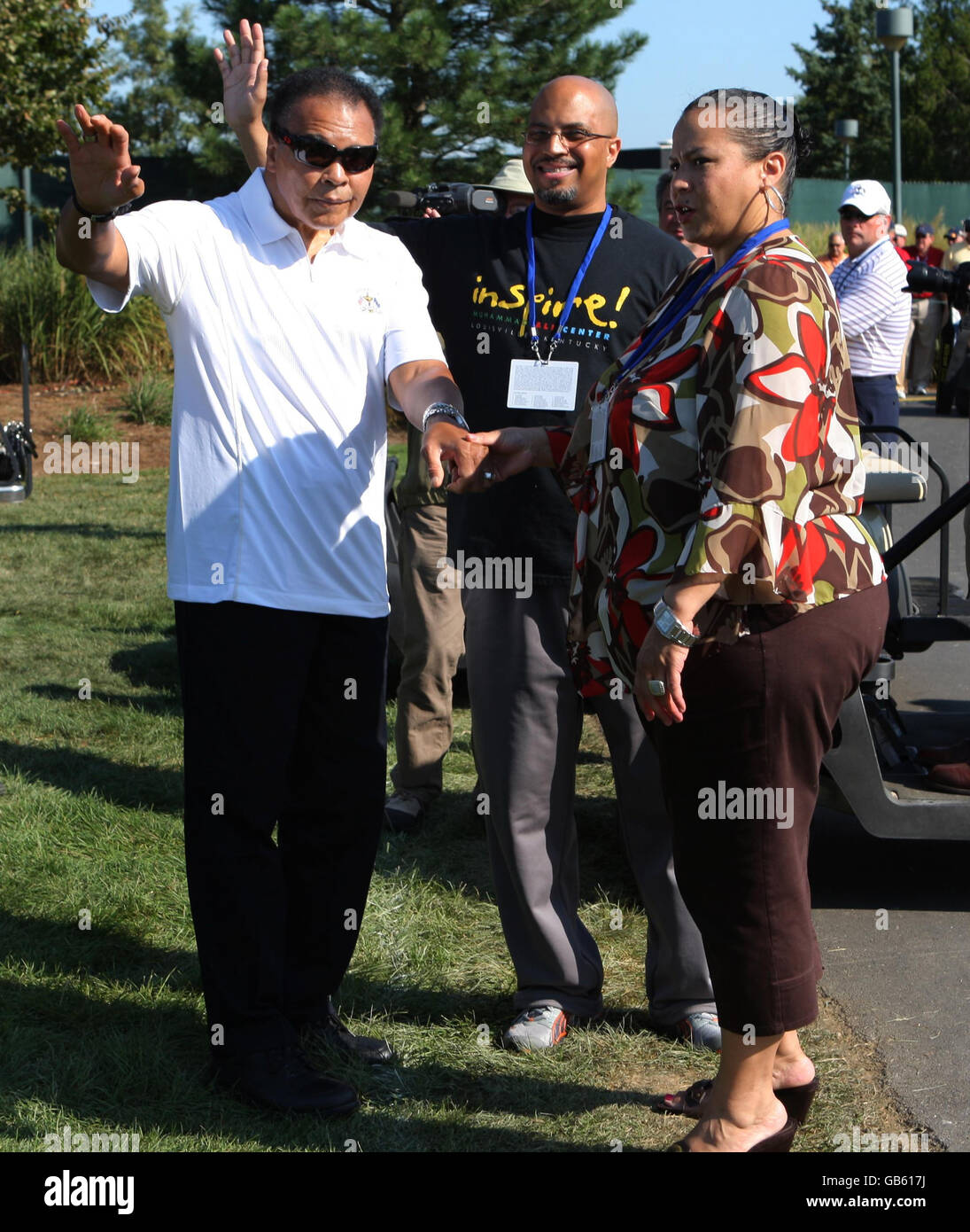 Boxing legend Muhammad Ali (centre) with his wife Lonnie Ali (right  pointing) and daughter Hana (left) in Ennis Co.Clare Ireland unveiling the  plaque on Turnpike Road to his ancestors after he was