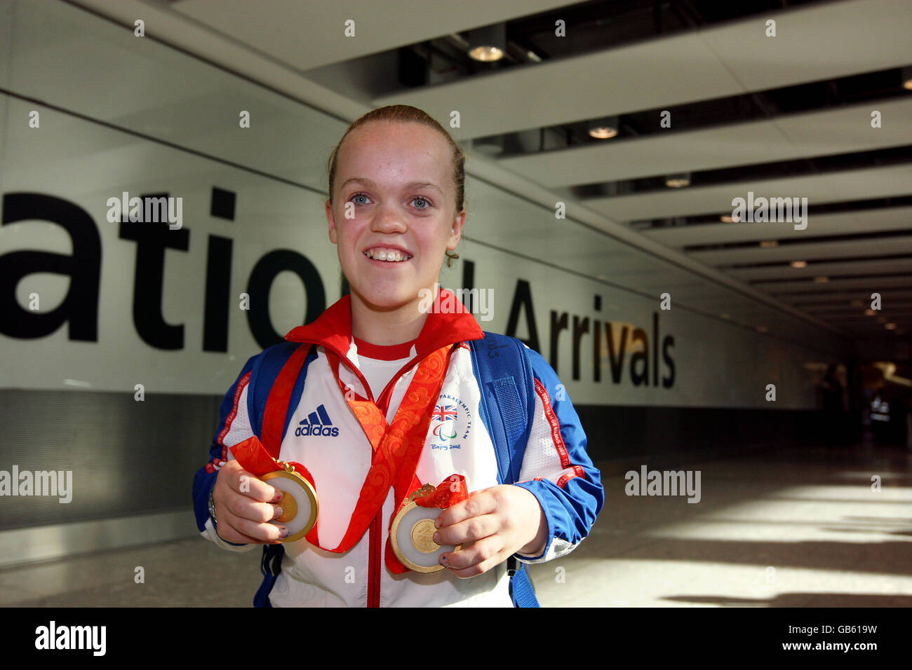 Paralympic swimmer 13-year-old Eleanor Simmonds with her 2 medals at Heathrow Airport, London. Stock Photo