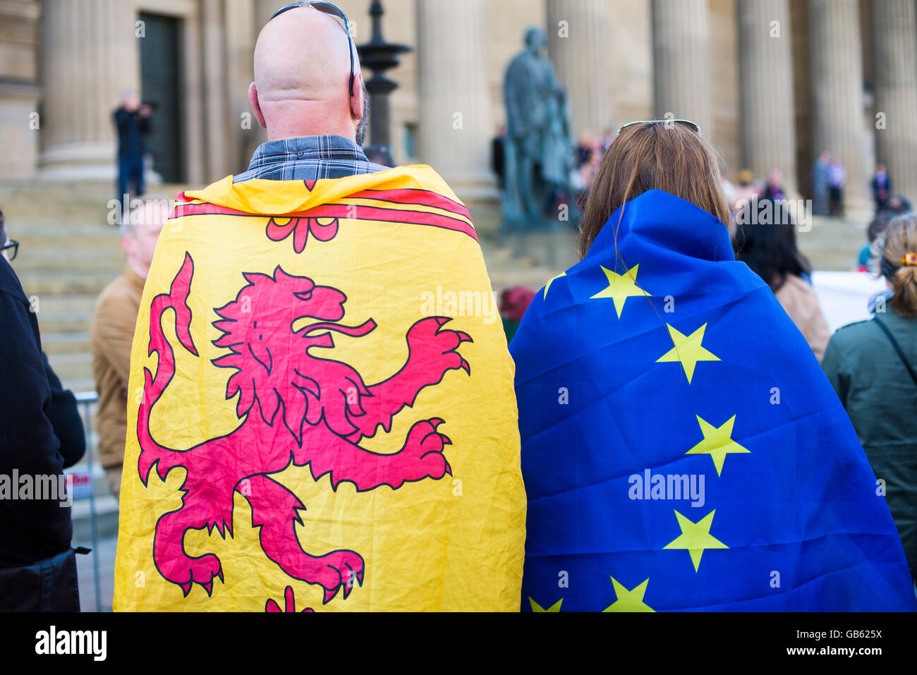 man and woman wrapped in EU flags pro EU rally Stock Photo