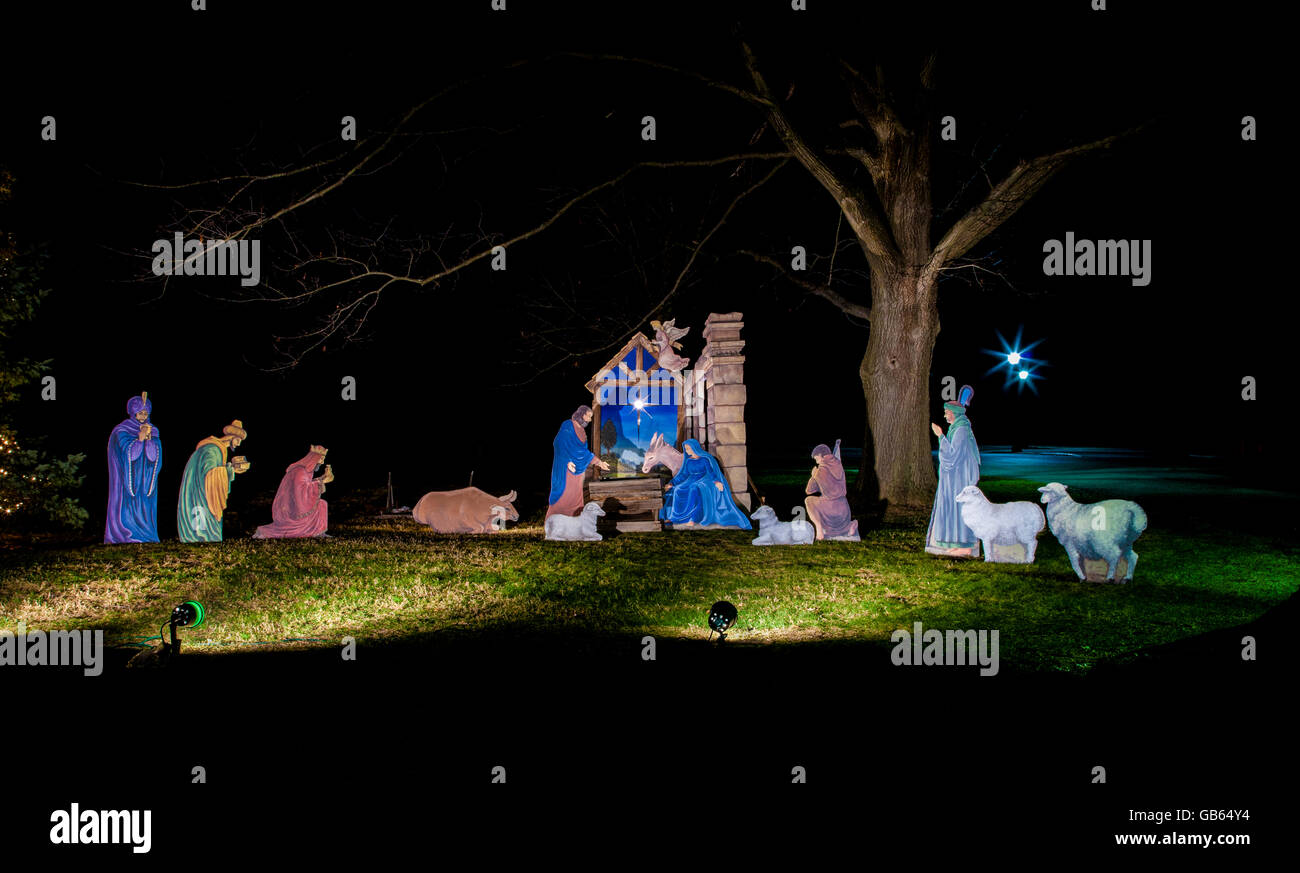 Christmas landscape scene nativity garden display at night with Yule