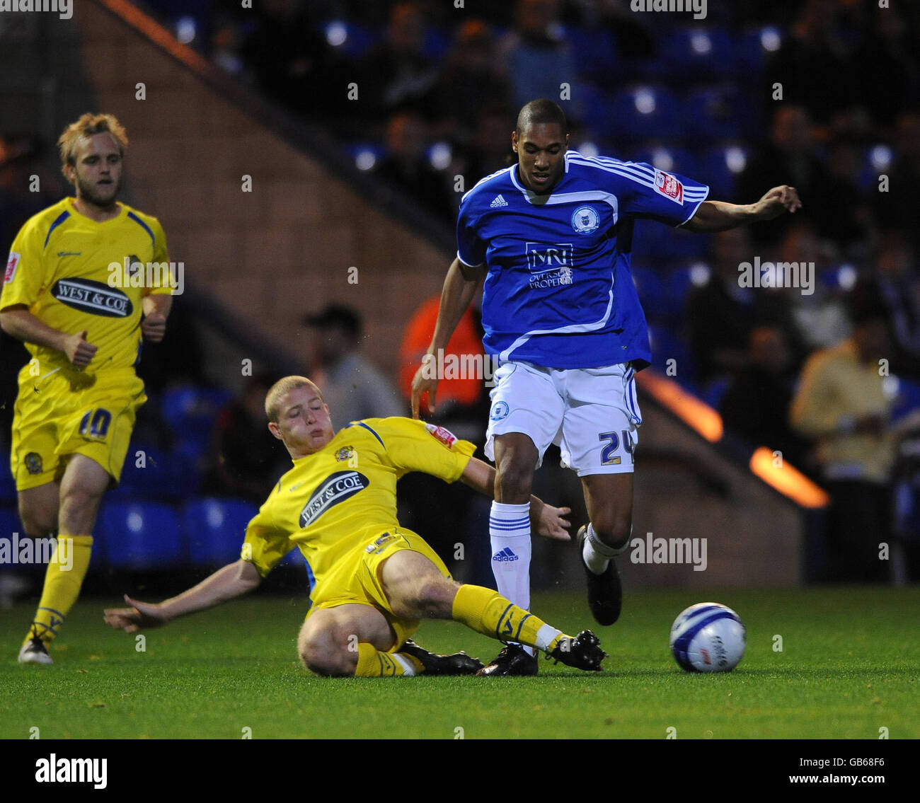 Soccer - Johnstone's Paint Trophy - Southern Section - Second Round - Peterborough United v Dagenham and Redbridge - London R.... Peterborough United's Shaun Batt and Dagenham and Redbridge's Scott Griffiths Stock Photo