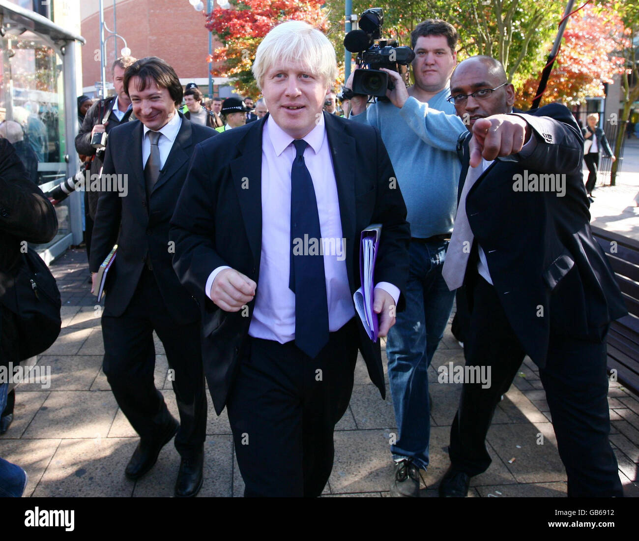 Mayor of London Boris Johnson (centre) during a walkabout in Bexleyheath town centre, Kent, after announcing plans for 30 locations to benefit from new transport policing teams. Stock Photo