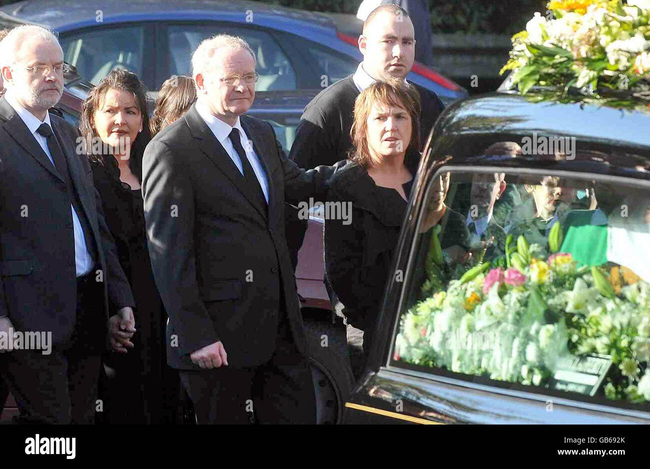Northern Ireland's Deputy First Minister Martin McGuinness, centre, walks behind the coffin of his mother, Peggy McGuinness, 84, before her Requiem Mass in St Columba's Church, Long Tower, in Derry. Peggy McGuinness, 84, died at her Elmwood Street home in the city's Bogside on Monday. Stock Photo