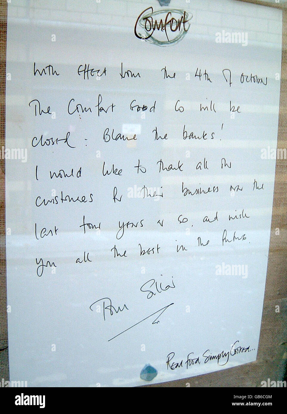 A close up view of a note left on the door of The Comfort Food Company, a restaurant in Pudding Chare, Newcastle, that has been put out of business by rising costs. Stock Photo