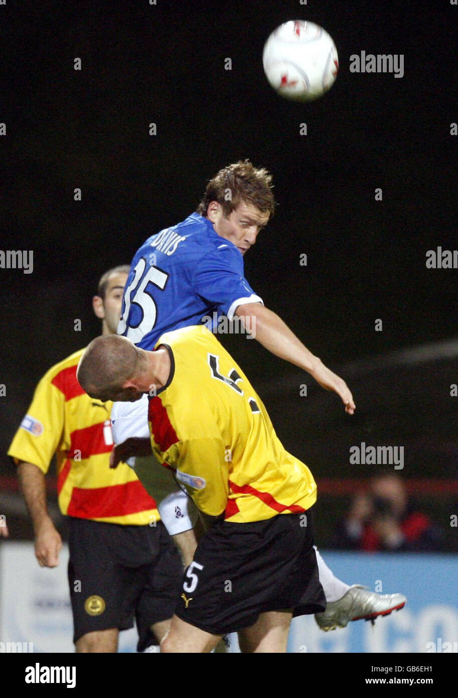 Rangers' Steven Davis (above) and Partick's Kevin McKinlay battle for the ball during the Co-Operative Insurance Cup Third Round match at Firhill, Glasgow. Stock Photo
