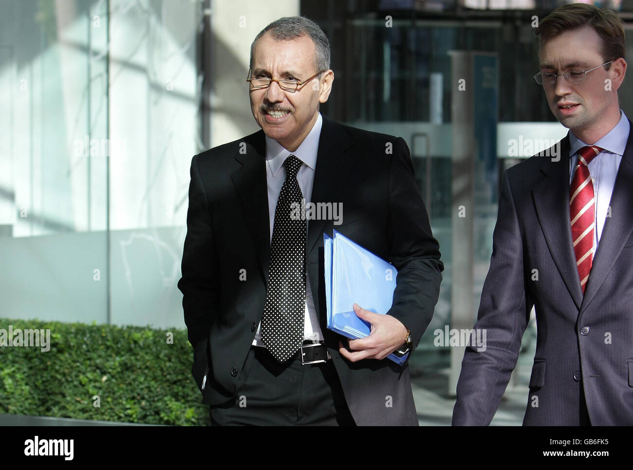 Dr Mohammed Taranissi (left) leaves a hearing at the General Medical Council, London, where he appeared before a disciplinary panel. Stock Photo