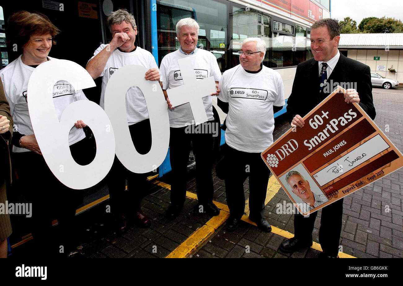 Transport Minister Conor Murphy (right) with 60 plus bus travellers who will benefit from free bus travel, at a photocall in Belfast. Stock Photo