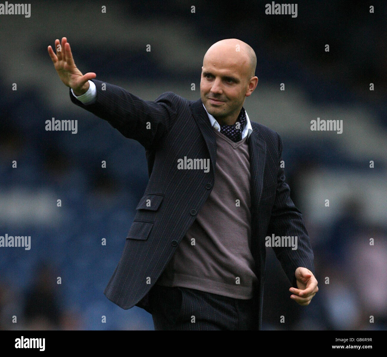 Soccer - Coca-Cola Football League Two - Bury v Exeter City - Gigg Lane. Exeter City's manager Paul Tisdale celebrates at the end of the game against Bury during the League Two match at Gigg Lane, Bury. Stock Photo