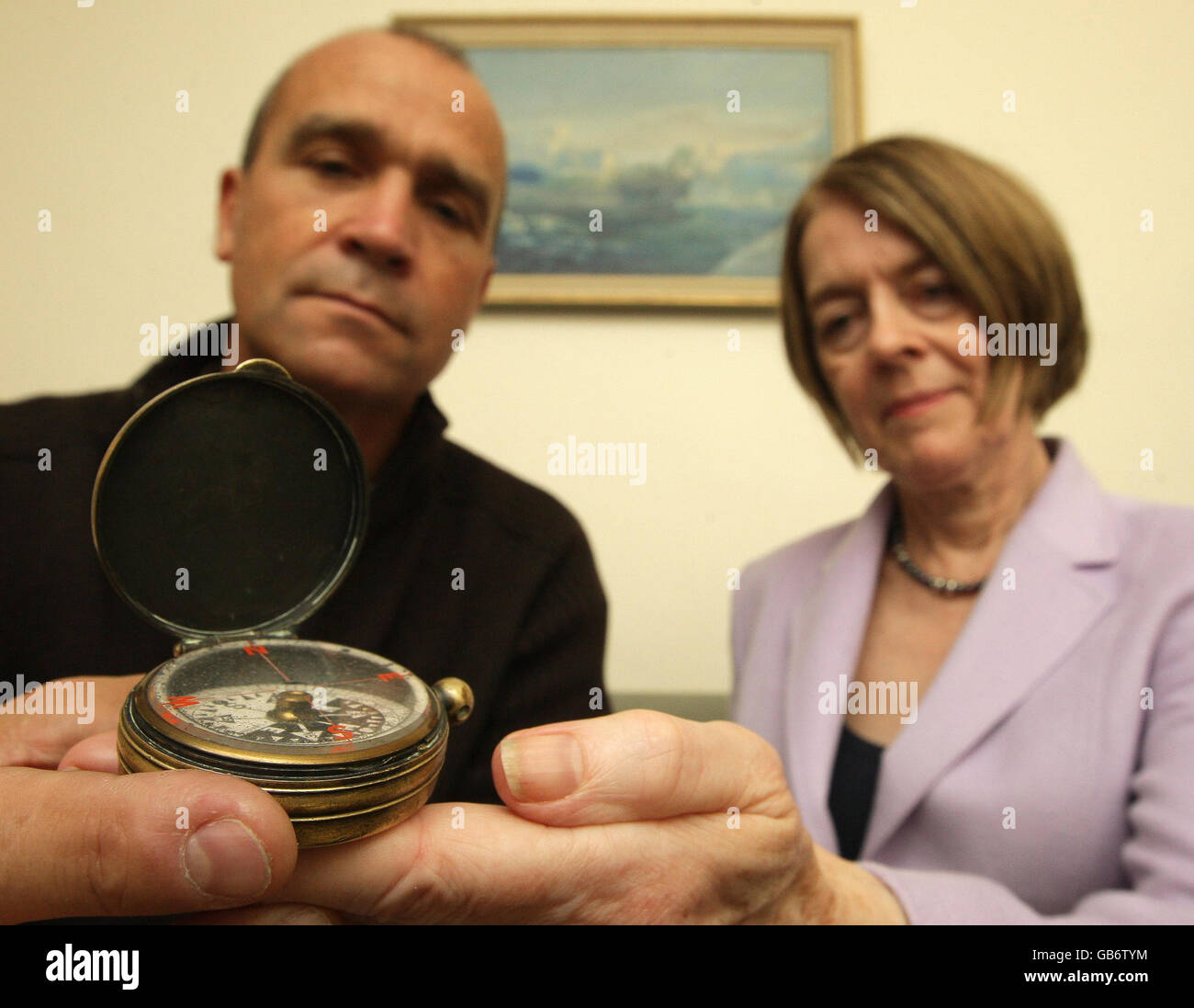 Alexandra Shackleton, the granddaughter of Antarctic explorer Ernest Shackleton at her home in Hammersmith, London, presents Shackleton's compass to explorer Henry Worley, who will set off on the Matrix Shackleton Centenary Expedition in November 2008, recreating Shackleton's 'Nimrod' expedition to reach the south pole. Stock Photo