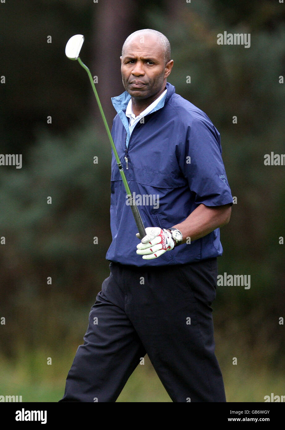 Luther Blissett plays in the rain at the Total UK Golf Day 2008 for childrens cancer charity CLICK sargent held at Sunningdale Golf Club, Berkshire. Stock Photo