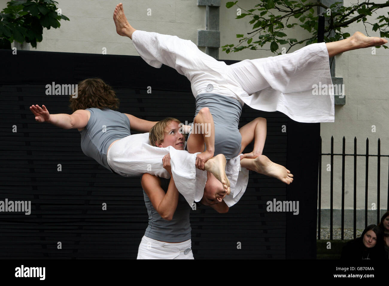 Members of the Mimbre dance company perform a piece called 'Sprung' as part of the Spraoi street festival in Waterford city centre Stock Photo