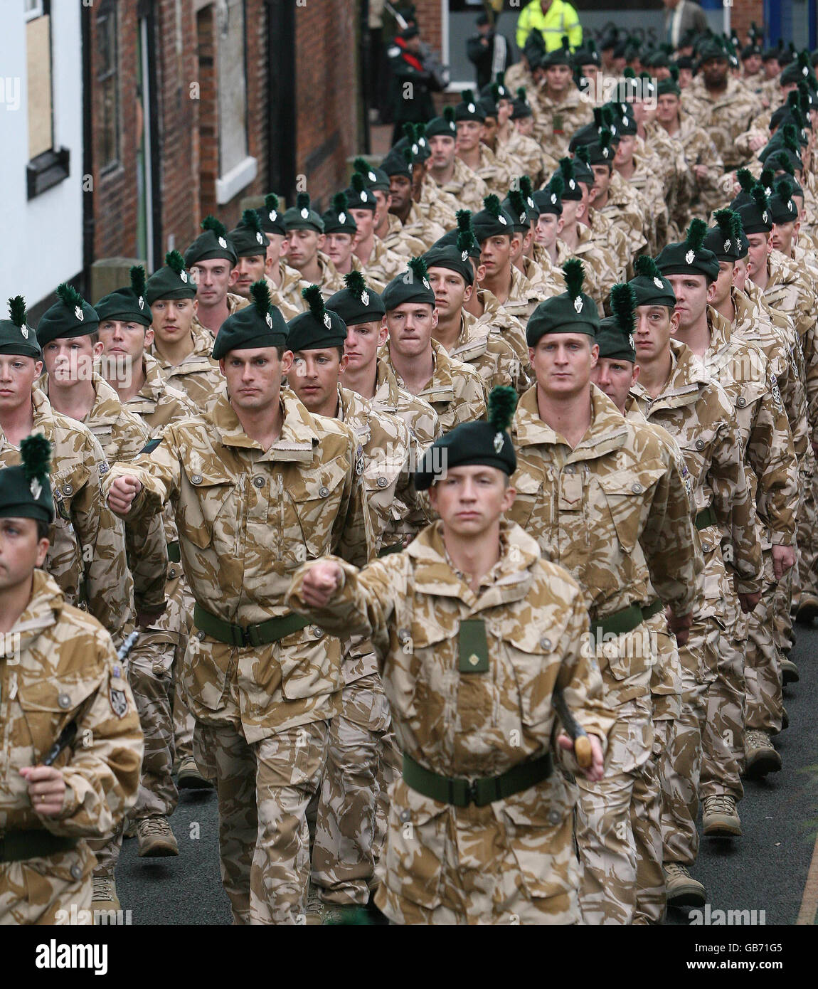 Members of the Royal Irish Regiment parade through Market Drayton, Shropshire, after returning home from Afghanistan. Stock Photo