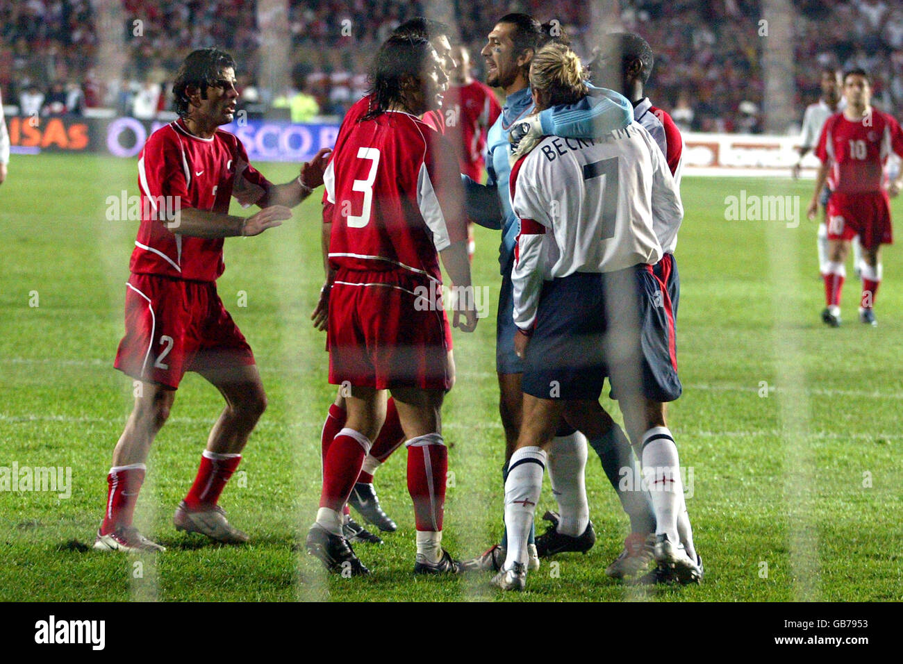 Turkey goalkeeper Rustu Recber (c) protects England's David Beckham as he is confronted by Turkey's Alpay Stock Photo