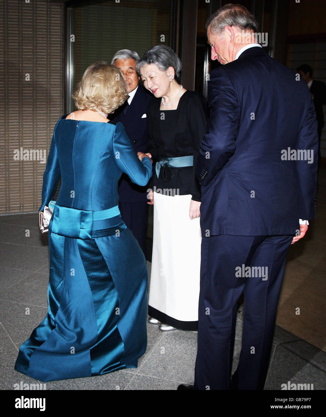 The Duchess of Cornwall is greeted by Empress Michiko whilst the Prince of Wales and Emperor Akihito look on, as the Royal couple arrive for a private dinner at the Imperial Palace, in Tokyo, Japan. Stock Photo